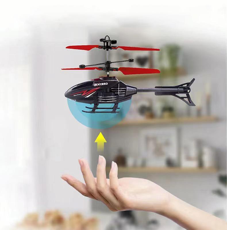 Mini helicopter for adults. Intelligent induction hovering aircraft, four-axis flying toy. A great gift toy for boys and girls. Red.