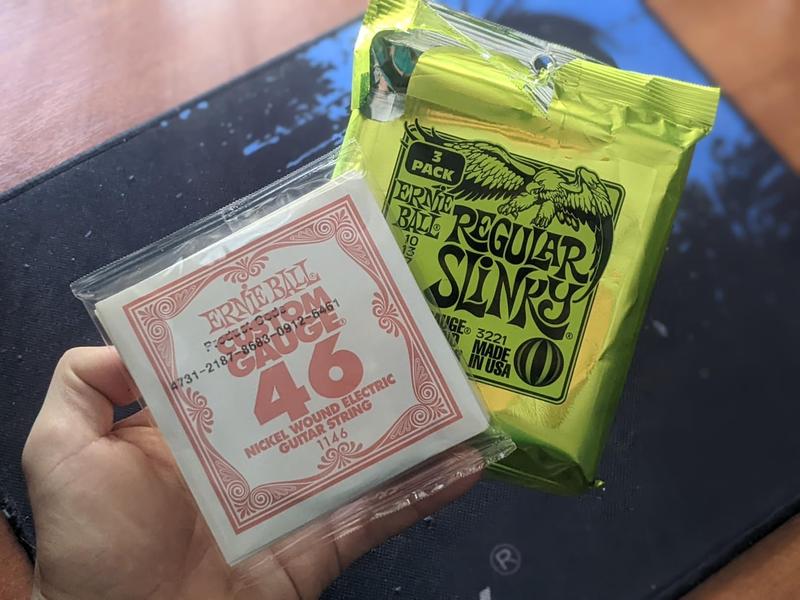 Ernie Ball Regular Slinky Nickel Wound Electric Guitar Strings  Exclusive 4-Pack - 10-46 Gauge