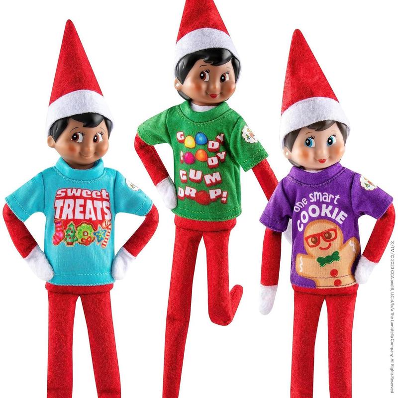 The Elf on the Shelf Claus Couture Sweet Treat Tees for Your Scout Elf - Includes Three tees with Collectible tin Suitcase for Accessories